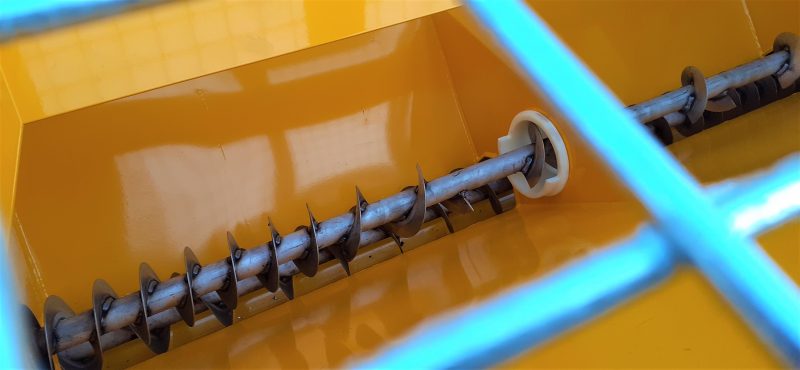 Stainless steel POZI-FEED double augers on the TS800DC Tug-Towed Salt Spreader provide positive salt feed even with wet material.