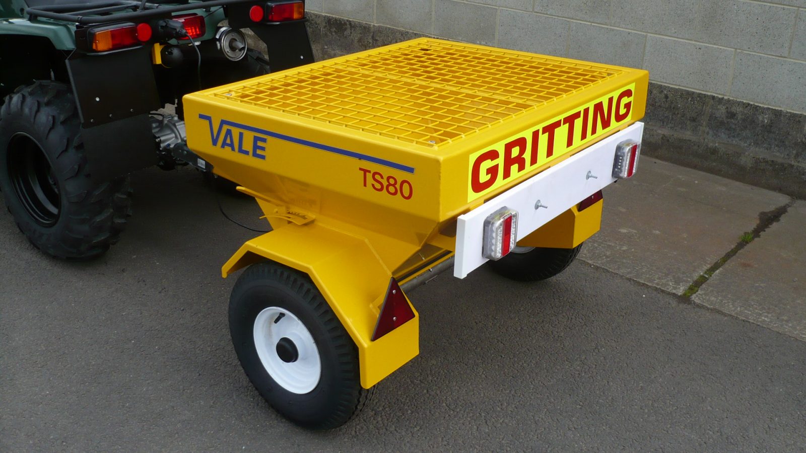 The ATV quad bike comes with VALE Engineering’s Towed Drop Gritter TS80
