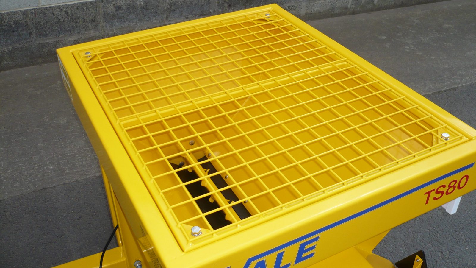 Agitator to aid salt delivery and mesh screen on VALE Engineering's Towed or Mounted Drop Gritter TS80